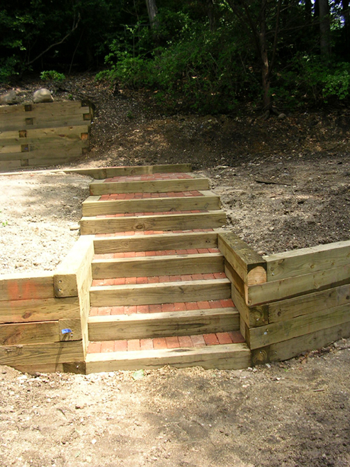 RAILROAD TIE WALLS AND CONCRETE PATIO BUILT IN LONG ISLAND, NY